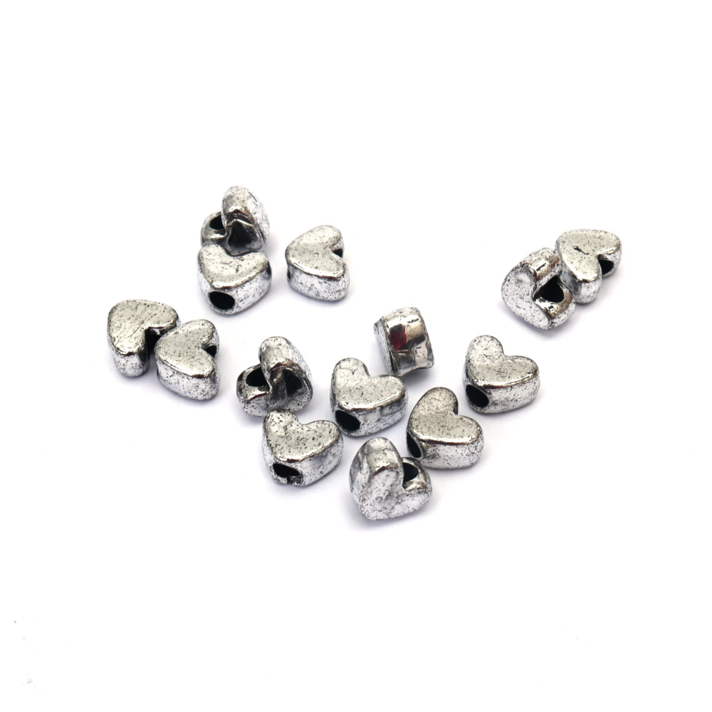 Margele inimă  metalic 11,5x9x7 mm gaură 3,5 mm culoare argintie -50 grame ~117 buc 