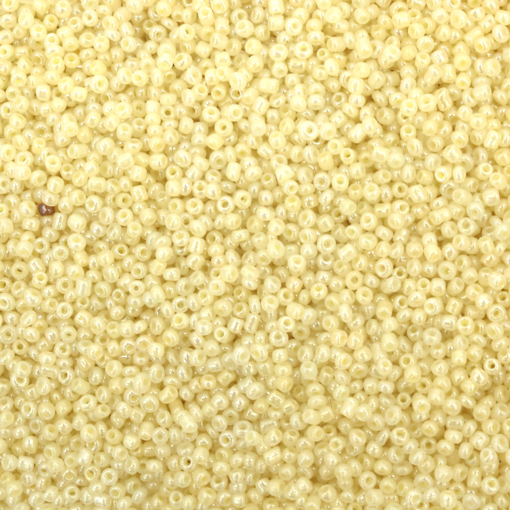 Γυάλινες χάντρες  seed 2 mm. Ελεφαντοστού Κεϋλάνης -50 γραμμάρια