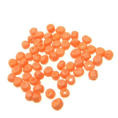 Glass beads 4 mm thick orange pale -50 grams