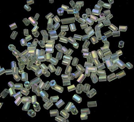 Γυάλινες χάντρες σε σχήμα ράβδου πάχος 2,5x2 mm διαφανές πολυγωνικό rainbow -50 γραμμάρια