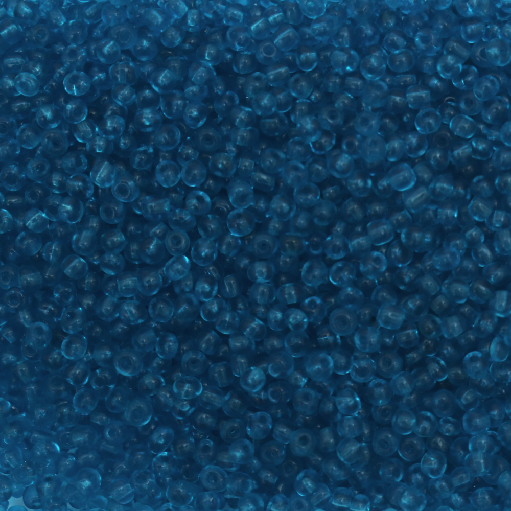 Мъниста стъклена 4 мм прозрачна синя циан -50 грама