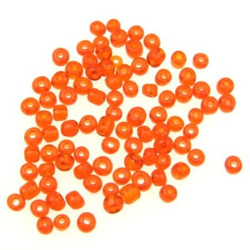 Γυάλινες χάντρες seed 4 mm διαφανές σκούρο πορτοκαλί -50 γραμμάρια