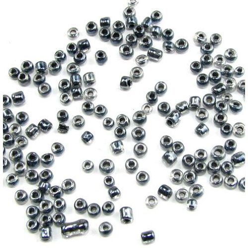 Γυάλινες χάντρες seed 3 mm διαφανείς με γυαλιστερή μαύρη βασή -50 γραμμάρια