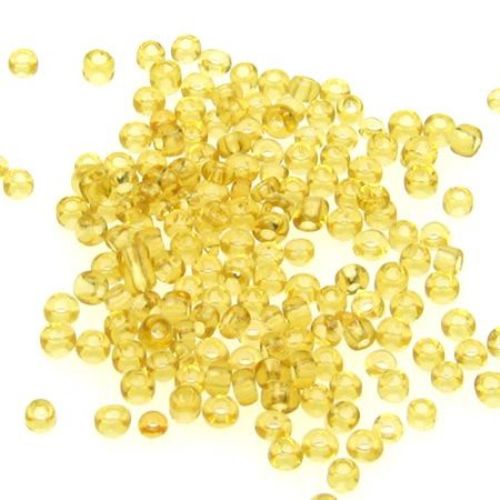 Γυάλινες χάντρες seed 3 mm διαφανές σκούρο χρυσό -50 γραμμάρια