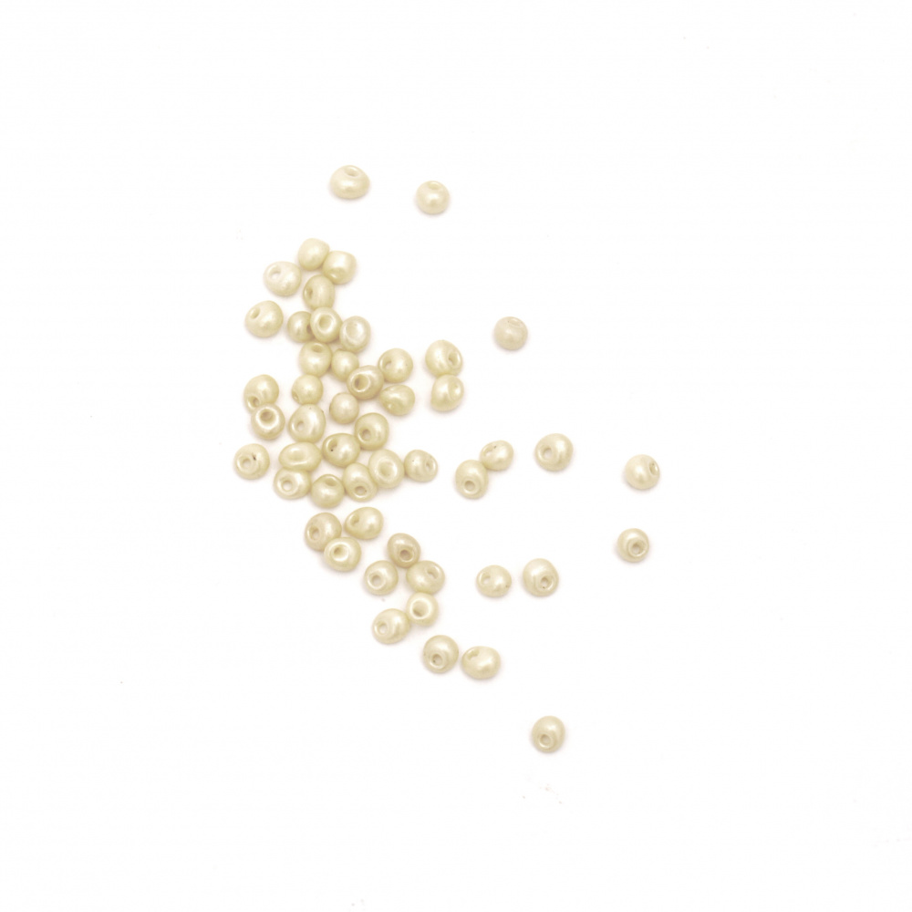 Γυάλινες χάντρες seed 3 ~ 3,5x2 ~ 3mm τρύπα 1 mm ελεφαντόδοντο -20 γραμμάριa