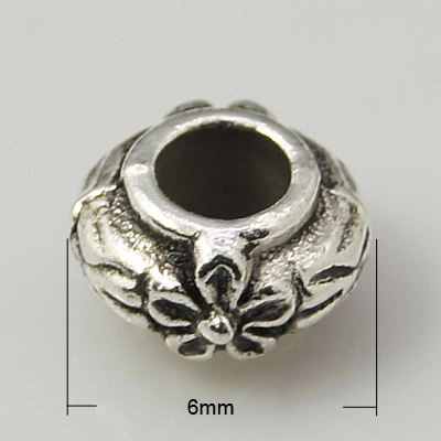 Oval metal cylinder bead, embossed with flower motif 6x4 mm hole 3 mm color old silver - 10 pieces