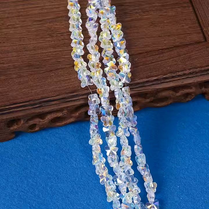 Șir de mărgele cristaline ursuleț 10x8.5x4 mm gaură 1 mm fațetate transparente galvanizate cu strat AB culoare alb curcubeu ~80 bucăți 