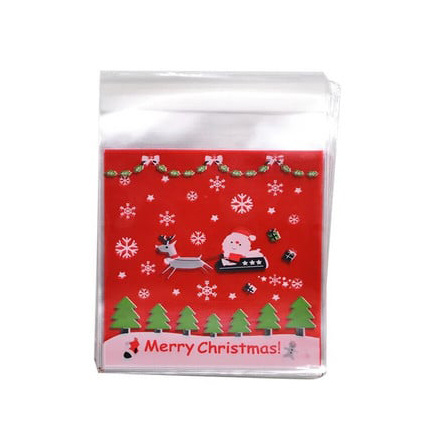 Plic de celofan 10x13 cm Moș Crăciun cu sanie, culoare transparentă cu spate roșu și adeziv - 100 bucăți