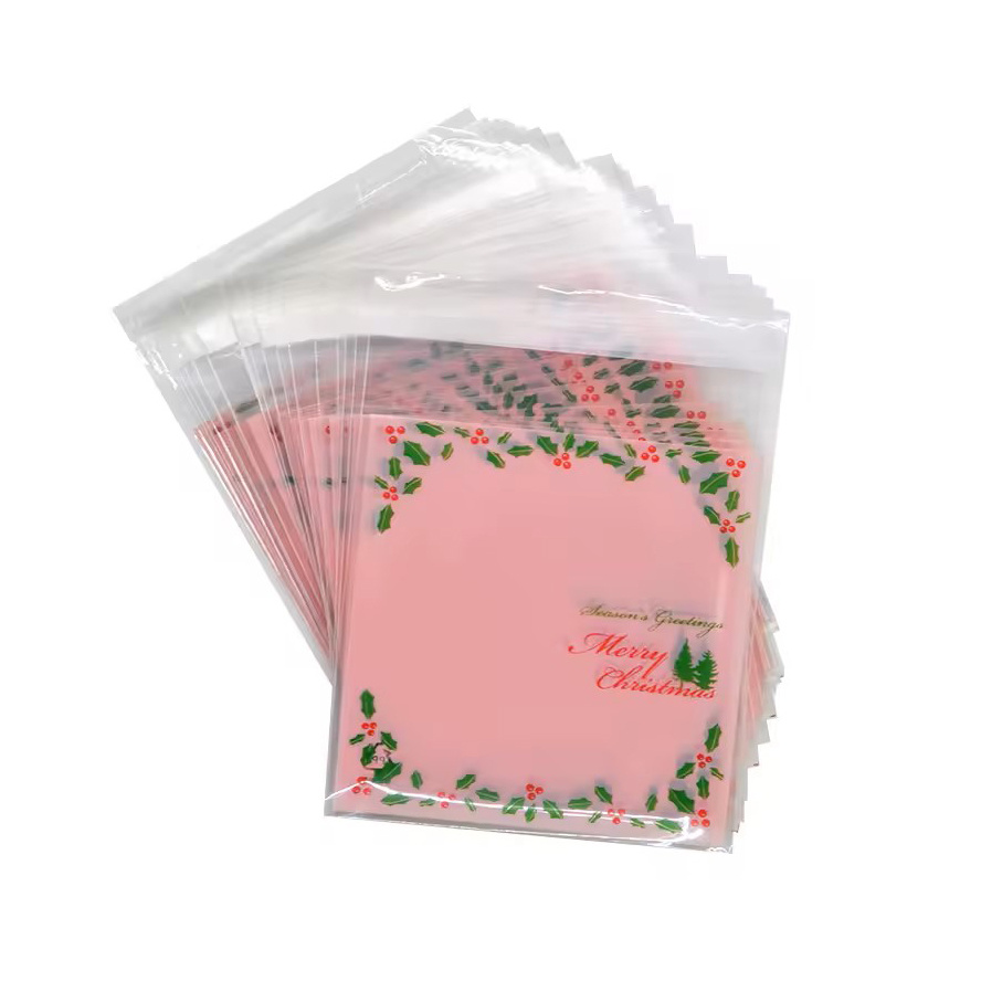 Plic de celofan 10x13 cm, culoarea Crăciunului, transparent, cu spate roz și adeziv - 100 bucăți