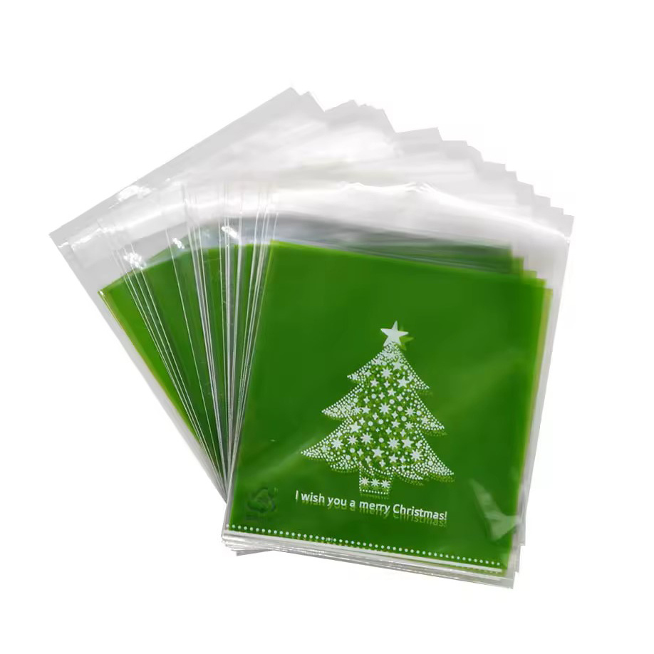 Plic de celofan 10x13 cm, culoarea bradului de Crăciun, transparent, cu spate verde și adeziv - 100 bucăți