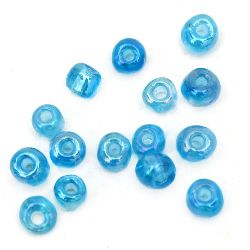 Γυάλινες χάντρες seed 4 mm διαφανές rainbow μπλε 1-50 γραμμάρια
