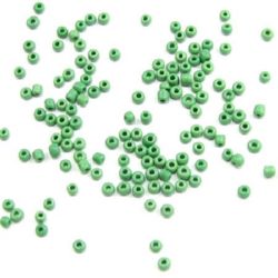 Γυάλινες χάντρες  seed πάχους 2 mm σκούρο πράσινο -50 γραμμάρια