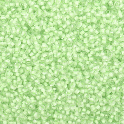 Γυάλινες χάντρες  seed 2 mm διαφανείς με κίτρινη βασή -50 γραμμάρια