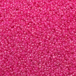 Γυάλινες χάντρες seed   2 mm διαφανείς με βασή λαμπερό κυκλαμίνο -50 γραμμάρια