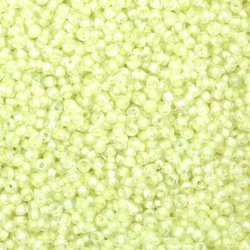  Γυάλινες χάντρες seed 2 mm διαφανείς με βασή ανοιχτό κίτρινο  -50 γραμμάρια