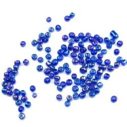 Γυάλινες χάντρες seed 3 mm διαφανές με βασή σκούρο μπλε -50 γραμμάρια