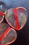 Bead with red thread heart 17 mm transparent -50 grams
