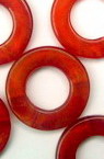 Round mother of pearl red 20mm. with hole 10mm. - 50gr.