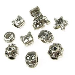 Assorted shapes and sizes jewellery stringing elements 9~14x8.5~12x5~8 mm hole 3~4mm - 20 grams ~ 8 pieces