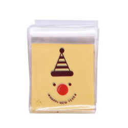 Plic de celofan 10x13 cm Clovn cu nas roșu, culoare transparentă, cu spate galben și adeziv - 100 bucăți