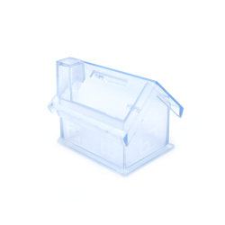 Blue plastic house-shaped box, measuring 57x67 mm