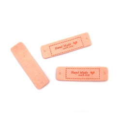 Ετικέτα από μαλακό σουέτ 40x1,5 mm με επιγραφή Handmade και καρδιά,  χρώμα ανοιχτό ροζ - 10 τεμάχια